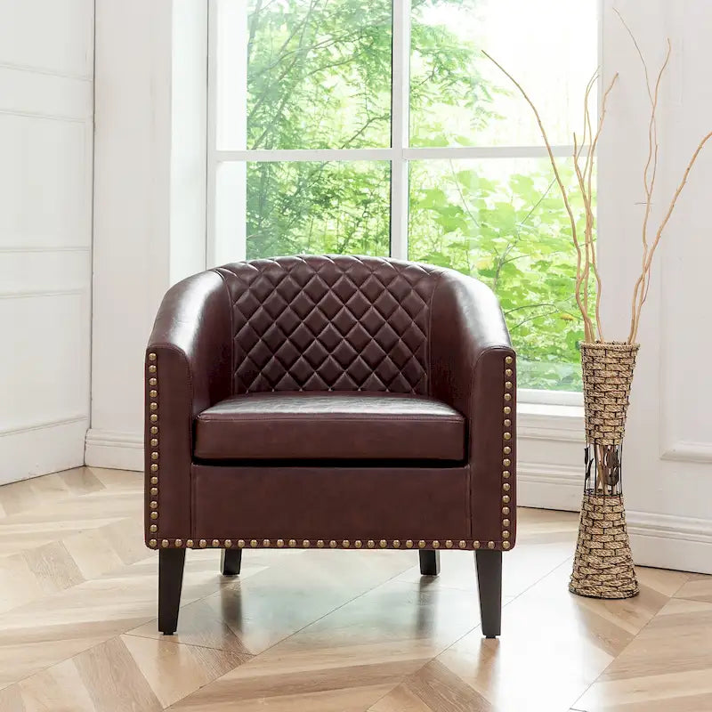 Fauteuil club en similicuir capitonné, avec clous décoratifs