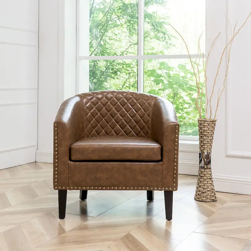 Fauteuil club en similicuir capitonné, avec clous décoratifs