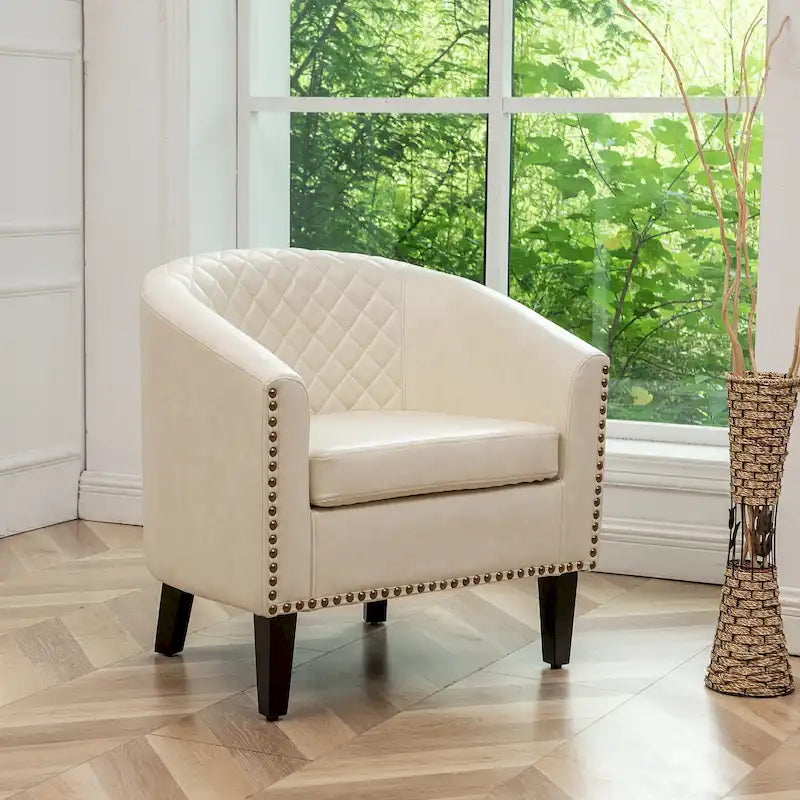 Fauteuil club en similicuir capitonné, avec clous décoratifs