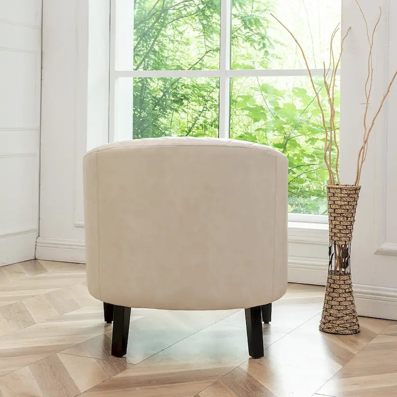 Fauteuil club en similicuir capitonné, avec clous décoratifs