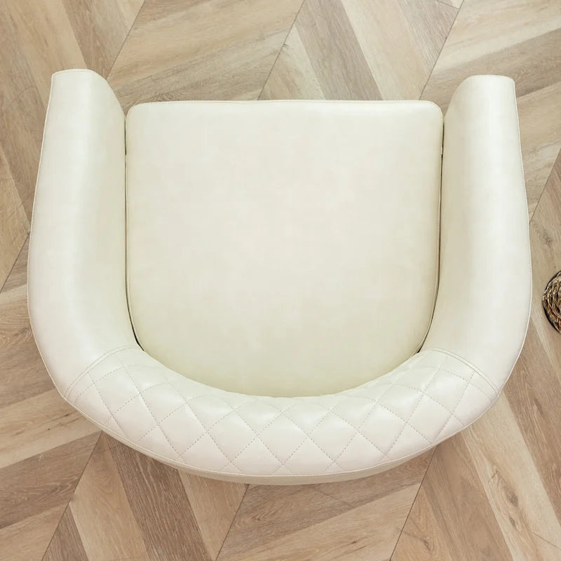 Fauteuil club en similicuir capitonné, avec clous décoratifs