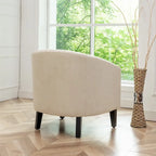 Fauteuil club en similicuir capitonné, avec clous décoratifs
