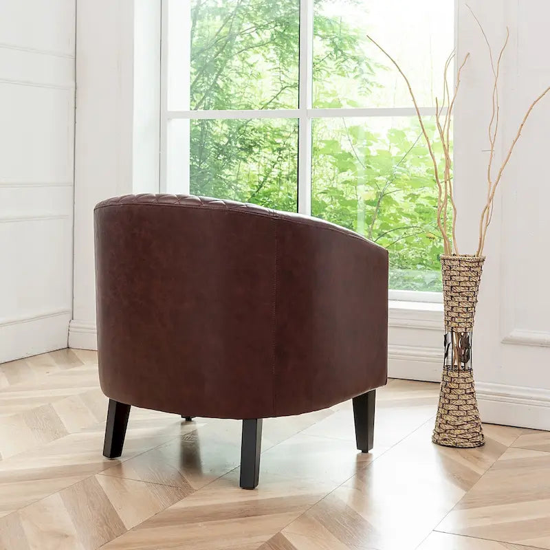 Fauteuil club en similicuir capitonné, avec clous décoratifs