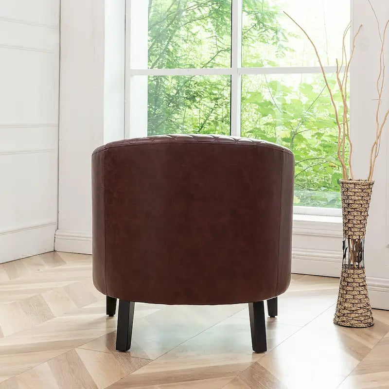 Fauteuil club en similicuir capitonné, avec clous décoratifs