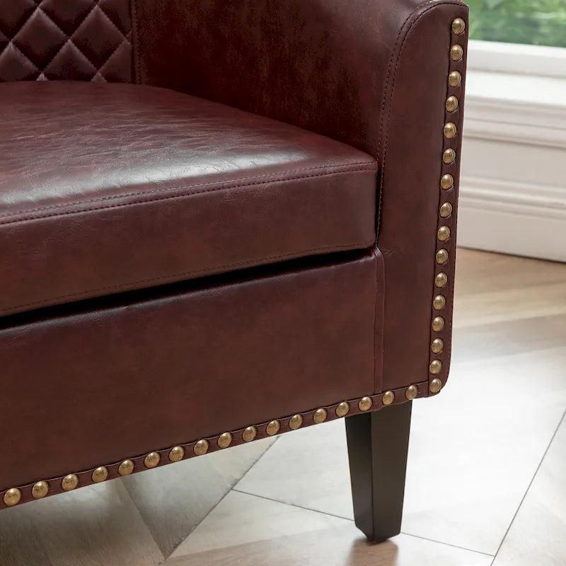 Fauteuil club en similicuir capitonné, avec clous décoratifs