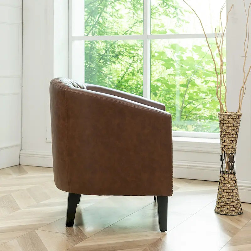 Fauteuil club en similicuir capitonné, avec clous décoratifs