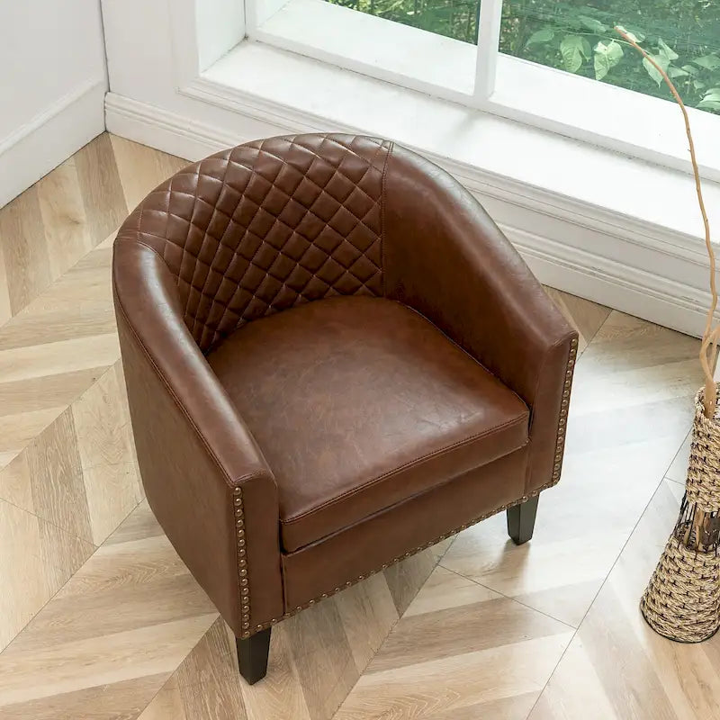 Fauteuil club en similicuir capitonné, avec clous décoratifs