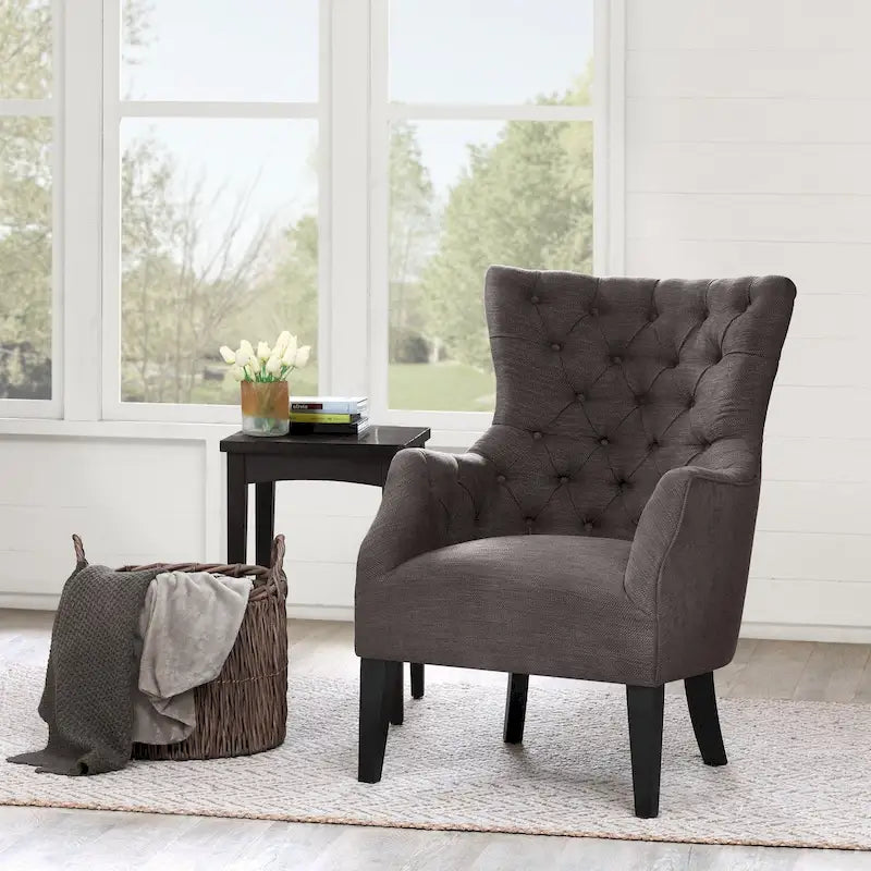Fauteuil à dossier haut à chevrons et capitonnage.