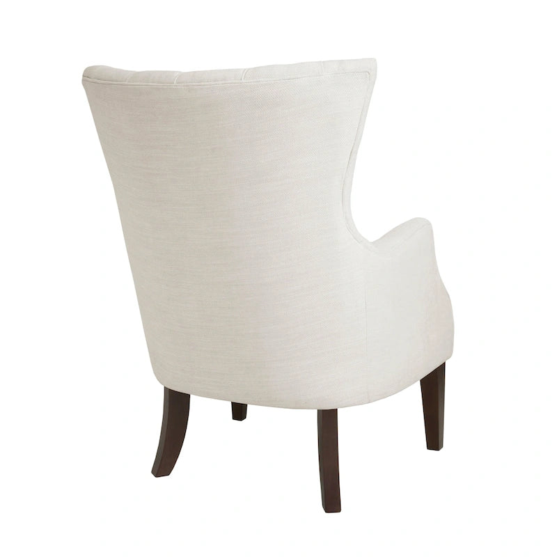 Fauteuil à dossier haut à chevrons et capitonnage.