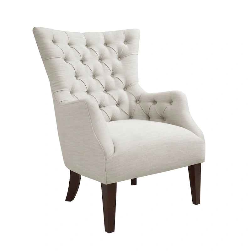 Fauteuil à dossier haut à chevrons et capitonnage.