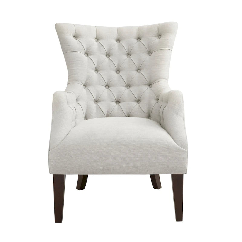 Fauteuil à dossier haut à chevrons et capitonnage.