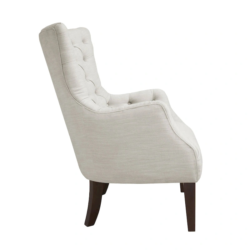 Fauteuil à dossier haut à chevrons et capitonnage.