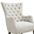 Fauteuil à dossier haut à chevrons et capitonnage.
