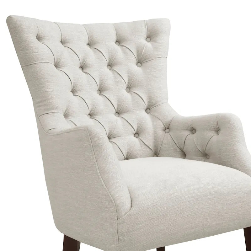 Fauteuil à dossier haut à chevrons et capitonnage.