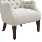 Fauteuil à dossier haut à chevrons et capitonnage.