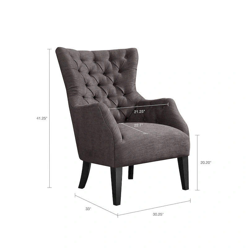 Fauteuil à dossier haut à chevrons et capitonnage.