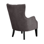 Fauteuil à dossier haut à chevrons et capitonnage.