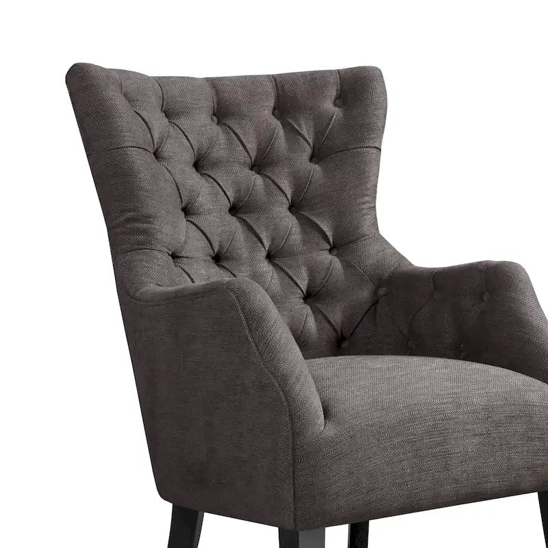 Fauteuil à dossier haut à chevrons et capitonnage.