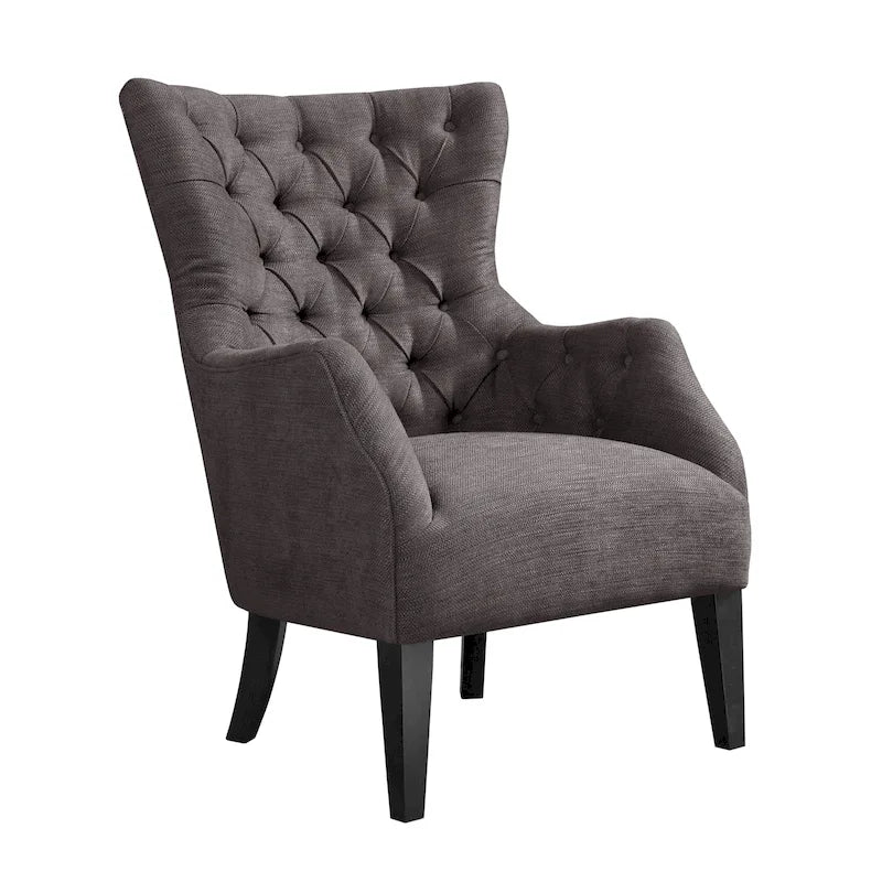 Fauteuil à dossier haut à chevrons et capitonnage.