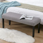 Banc rembourré moderne de 112 cm avec pieds en bois et clous décoratifs