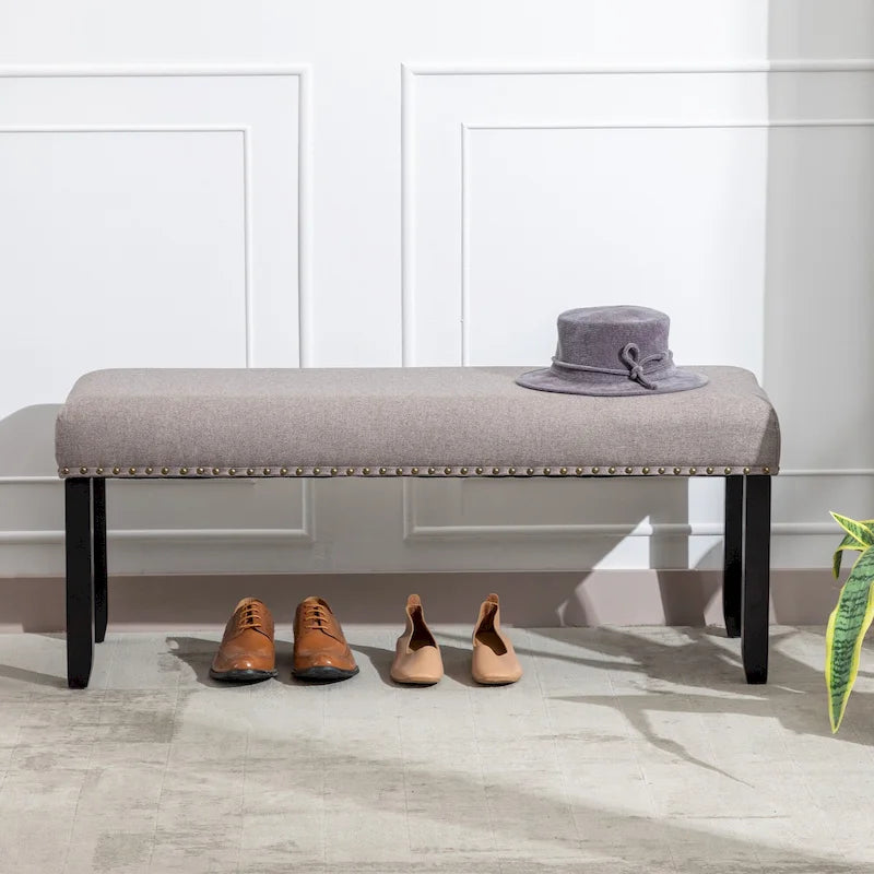 Banc rembourré moderne de 112 cm avec pieds en bois et clous décoratifs